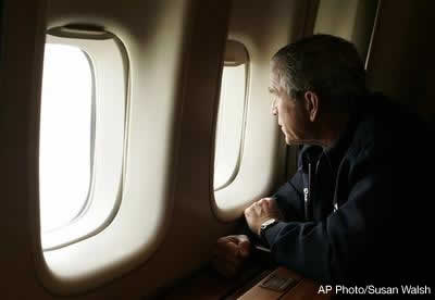 President Bush looks out the window of Air Force One inspecting damage from Hurricane Katrina while flying over New Orleans en route back to the White House, Wednesday, Aug. 31, 2005. AP Photo/Susan Walsh